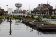 A man walks along a street as heavy rainfall continues in Baghdad on April 12, 2023. (Photo by AHMAD AL-RUBAYE / AFP) (Photo by AHMAD AL-RUBAYE/AFP via Getty Images)