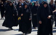 Shiite Muslim pilgrims march from the centre of Baghdad towards its northern district of Kadhimiya on February 13, 2023 to commemorate the anniversary of Imam Musa al-Kadhim's death in the 8th century AD. (Photo by AHMAD AL-RUBAYE / AFP) (Photo by AHMAD AL-RUBAYE/AFP via Getty Images)