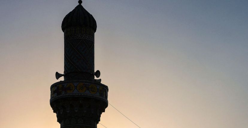 The decorated minaret of the Ottoman-era Wazir mosque, built in 1599 by the Ottoman governor Hassan Pasha, is pictured at sunset near al-Mutanabbi Street in central Baghdad on September 25, 2023. (Photo by Ahmad AL-RUBAYE / AFP) (Photo by AHMAD AL-RUBAYE/AFP via Getty Images)